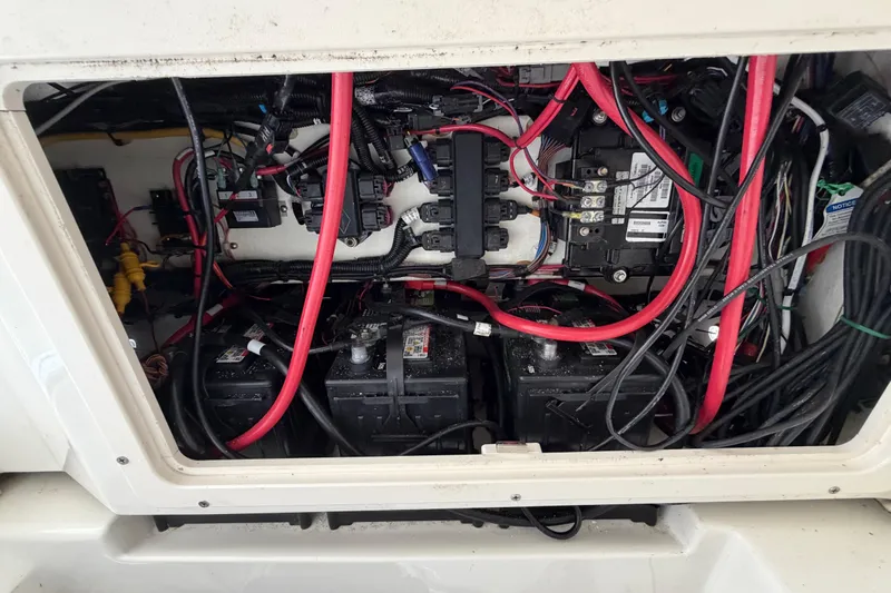 Slide: The Image of Electrical wiring and battery setup inside a 2017 Mako 284 Center Console boat. - 43