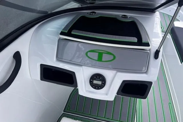 Slide: The Image of 2022 Tahoe 185 S boat interior with green accents and storage compartments. - 15