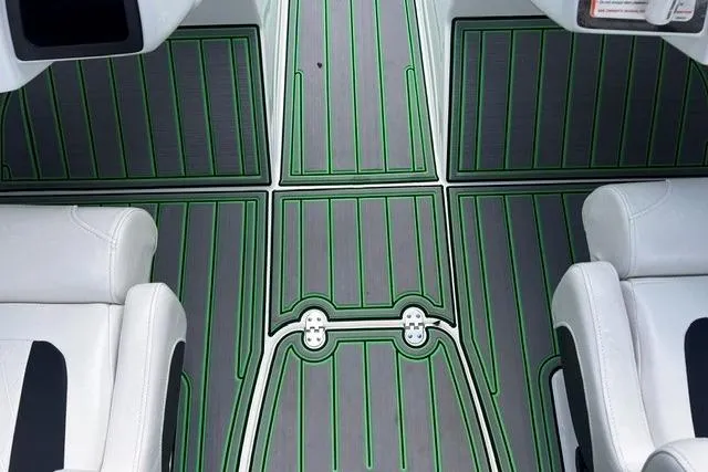 Slide: The Image of 2022 Tahoe 185 S boat interior with stylish green and gray flooring. - 16