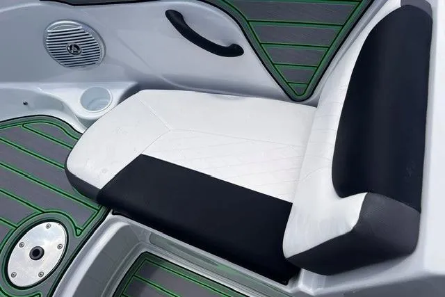 Slide: The Image of 2022 Tahoe 185 S boat interior with black and white seating, green-accented flooring. - 7