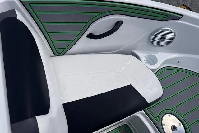 Slide: The Image of Interior of 2022 Tahoe 185 S boat with black and white seating, green accents. - 8