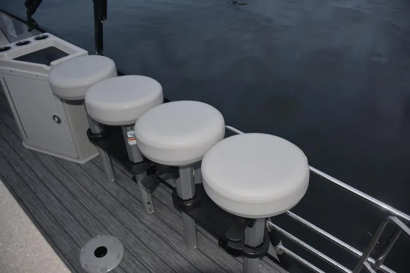 Slide: The Image of Manufacturer Provided Image: Four white bar stools on a 2022 Sylvan L3 DLZ Bar pontoon boat. - 14