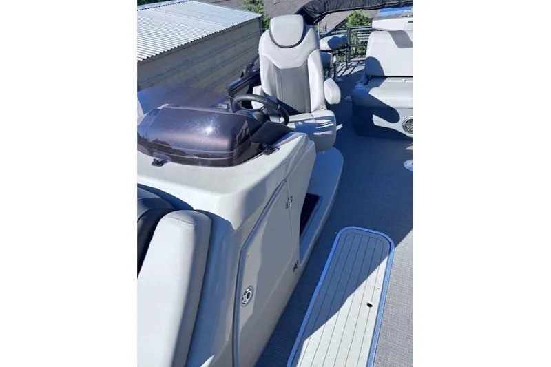 Slide: The Image of 2022 Sylvan L3 DLZ Bar boat interior with modern helm and seating. - 4