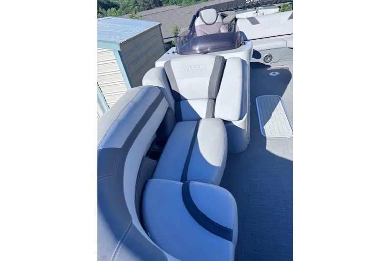 Slide: The Image of 2022 Sylvan L3 DLZ Bar boat interior with plush seating and modern design. - 6