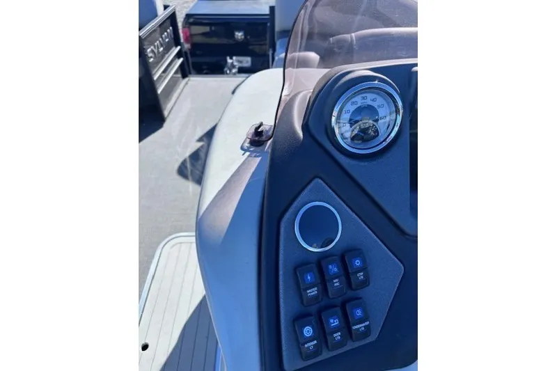 Slide: The Image of Control panel of 2022 Sylvan L3 DLZ Bar boat with speedometer and switches. - 7