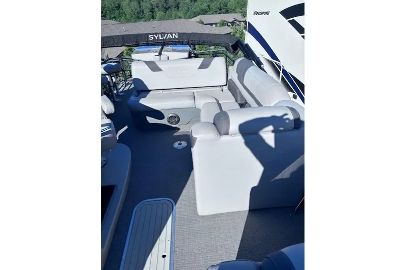 Slide: The Image of 2022 Sylvan L3 DLZ Bar pontoon boat with spacious seating and modern design. - 9