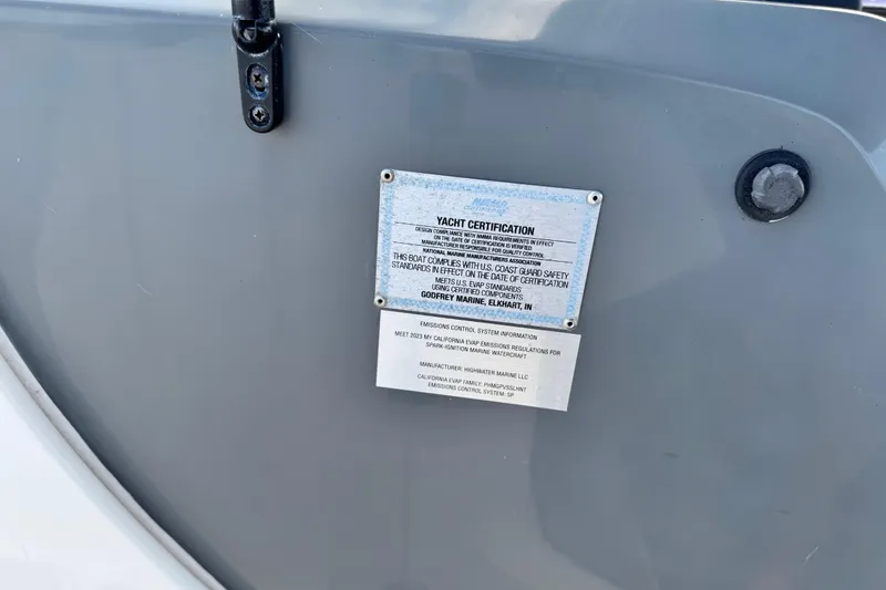 Slide: The Image of Yacht certification plaque on 2023 Hurricane SunDeck 2600 OB, displaying compliance and safety standards. - 21