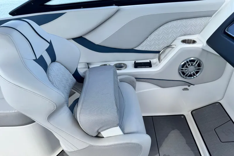 Slide: The Image of 2023 Hurricane SunDeck 2600 OB boat interior with stylish seating and speaker system. - 23