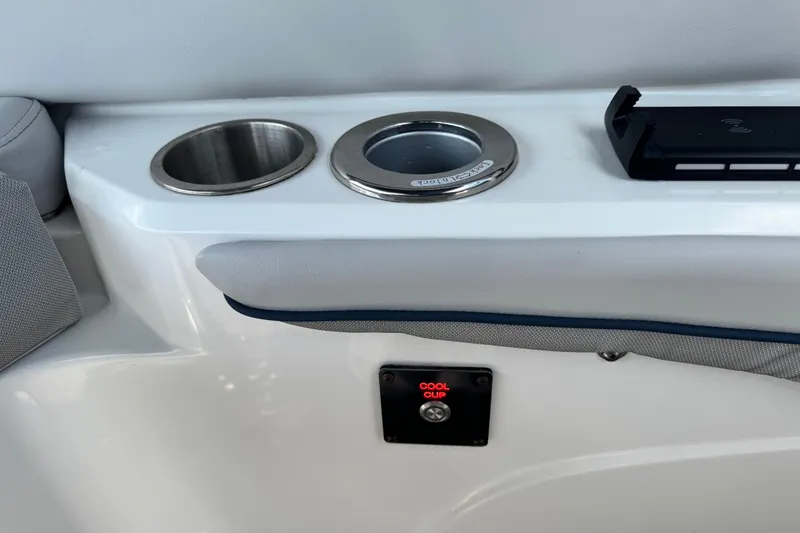 Slide: The Image of 2023 Hurricane SunDeck 2600 OB boat interior with cup holders and cool cup feature. - 24