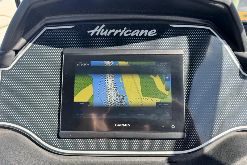 Slide: The Image of Dashboard of 2023 Hurricane SunDeck 2600 OB with Garmin navigation display. - 27