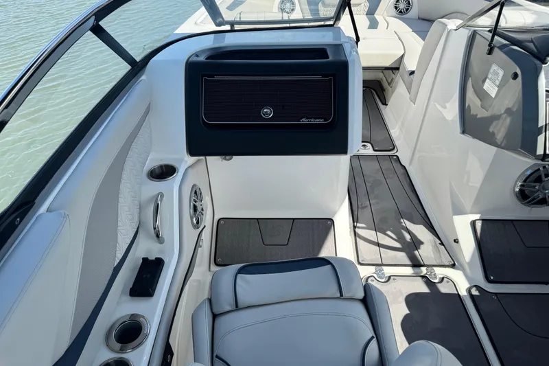 Slide: The Image of 2023 Hurricane SunDeck 2600 OB interior with seating, cup holders, and sleek design. - 30