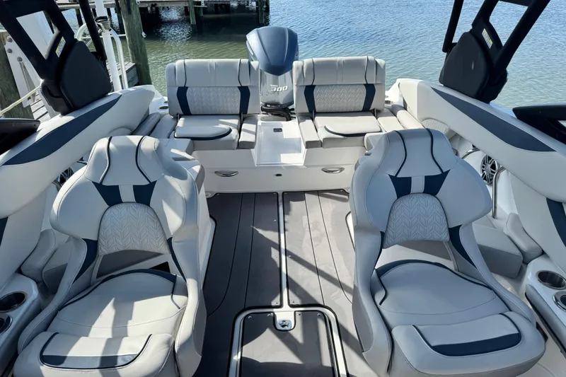 Slide: The Image of 2023 Hurricane SunDeck 2600 OB boat interior with luxurious seating and modern design. - 31