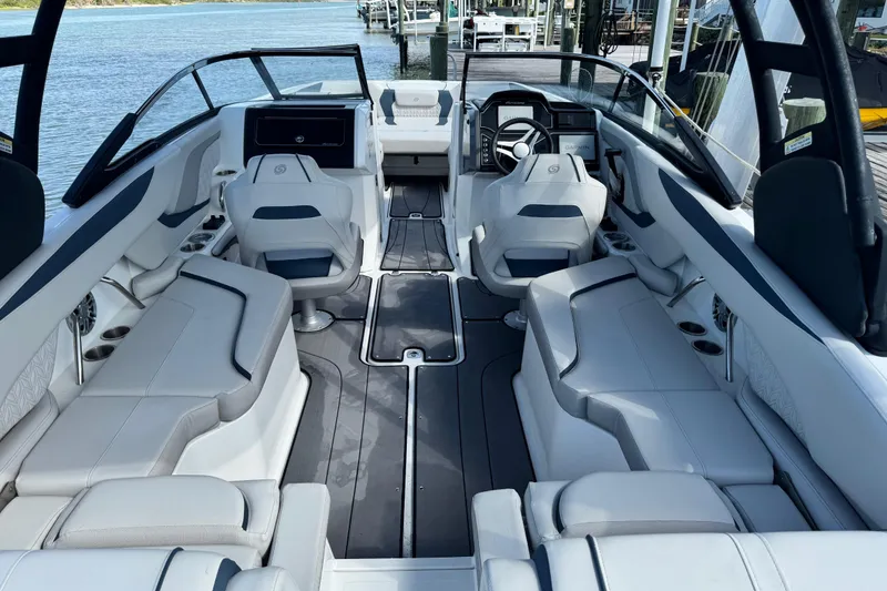 Slide: The Image of Interior view of 2023 Hurricane SunDeck 2600 OB boat with spacious seating and modern design. - 32