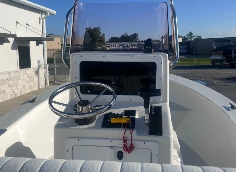 Slide: The Image of Steering console of a 2020 May-Craft 1900CC boat outdoors. - 10