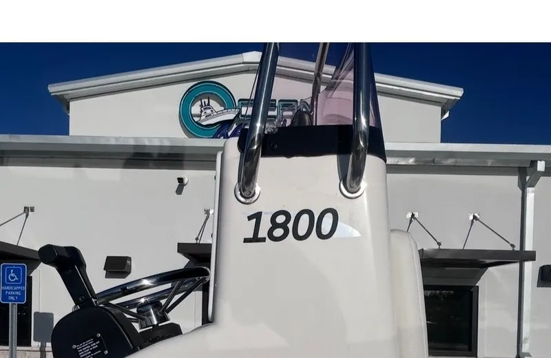 Slide: The Image of May-Craft 1900CC boat in front of building, year 2020. - 12