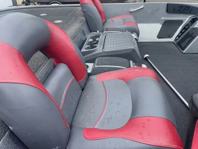 Slide: The Image of Interior of a 2015 Nitro Z-8 boat with red and gray seats. - 8