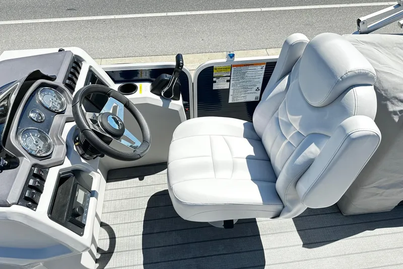 Slide: The Image of Captain's chair and dashboard of 2023 Godfrey Sweetwater 2286 SB pontoon boat. - 5