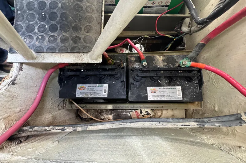 Slide: The Image of Battery compartment of a 1988 Bertram 50 Convertible boat with wiring connections. - 23