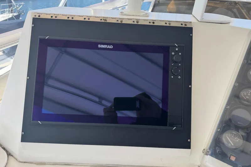 Slide: The Image of Simrad navigation display on 1988 Bertram 50 Convertible yacht dashboard. - 28