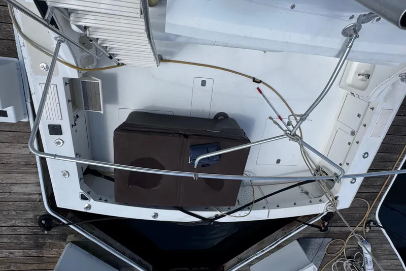 Slide: The Image of Overhead view of 1988 Bertram 50 Convertible boat deck at dock. - 40