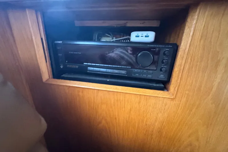 Slide: The Image of Sony stereo system in a 1988 Bertram 50 Convertible boat's wooden cabinet. - 46