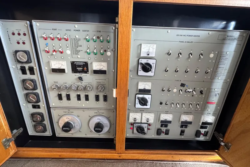 Slide: The Image of Electrical control panel on a 1988 Bertram 50 Convertible yacht, featuring various switches and gauges. - 57