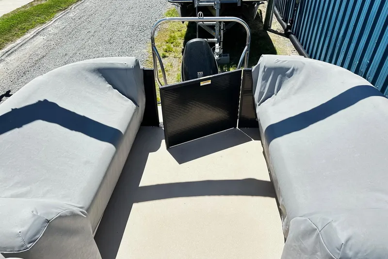 Slide: The Image of 2016 Godfrey Sweetwater 2286SB pontoon boat interior with covered seating and open gate. - 11