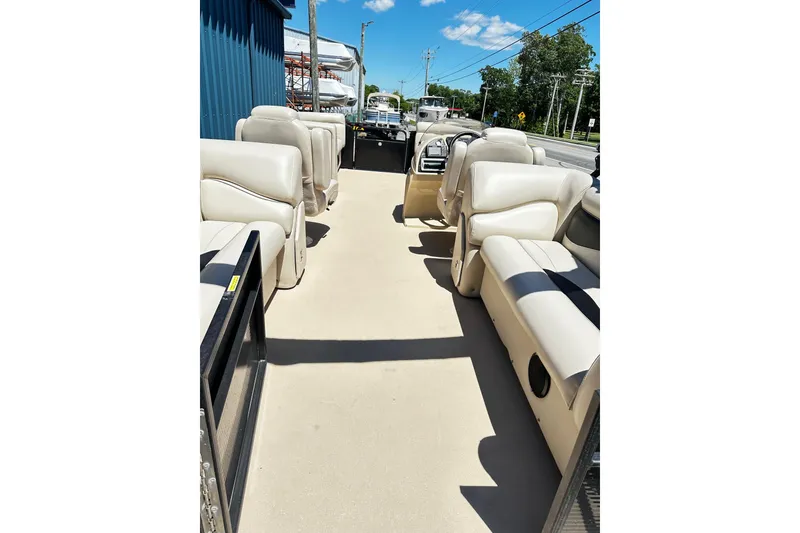 Slide: The Image of 2016 Godfrey Sweetwater 2286SB pontoon boat interior with beige seating. - 7