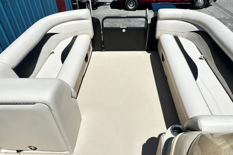 Slide: The Image of Interior of a 2016 Godfrey Sweetwater 2286SB pontoon boat with white seating. - 8