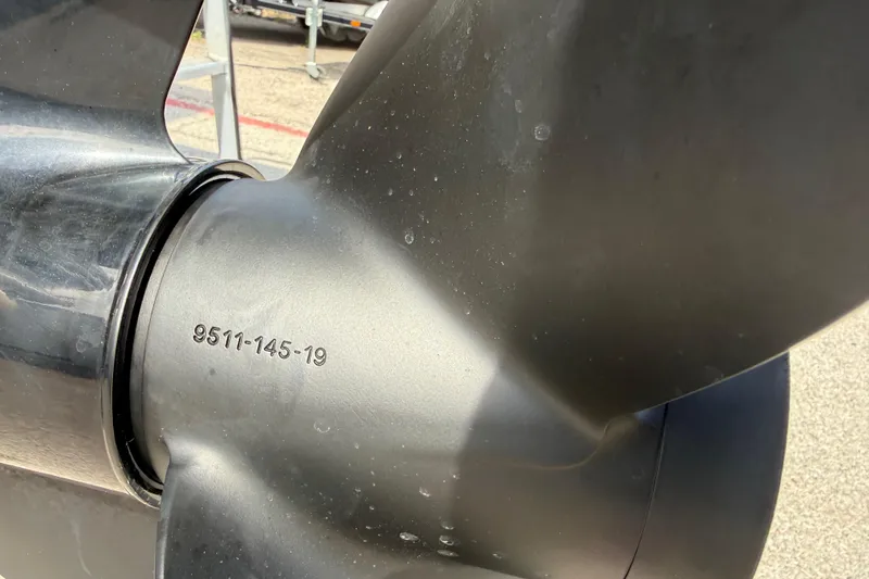 Slide: The Image of Close-up of a 2021 Sun Tracker SportFish 22 DLX boat propeller with engraved numbers. - 11