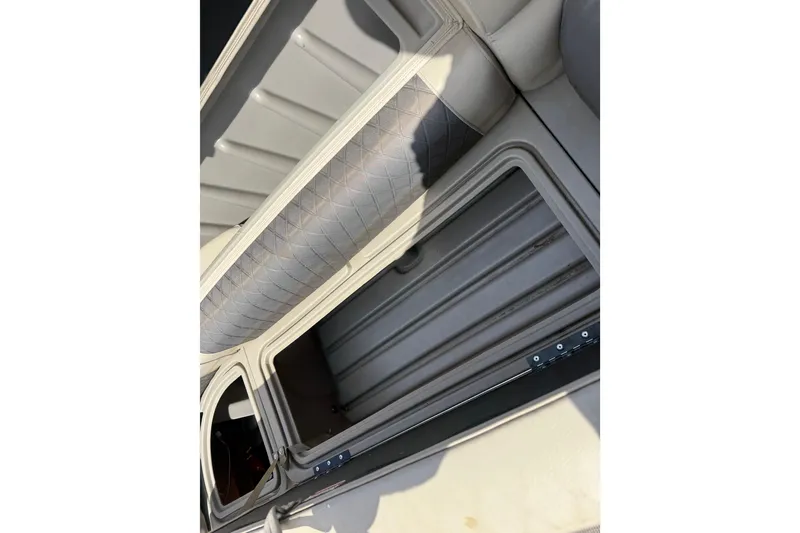 Slide: The Image of 2021 Sun Tracker SportFish 22 DLX boat interior storage compartment. - 27