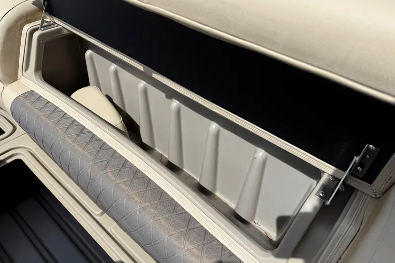 Slide: The Image of Sun Tracker SportFish 22 DLX 2021 boat storage compartment with cushioned seating. - 28