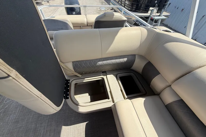 Slide: The Image of 2021 Sun Tracker SportFish 22 DLX boat interior with open storage compartments. - 34