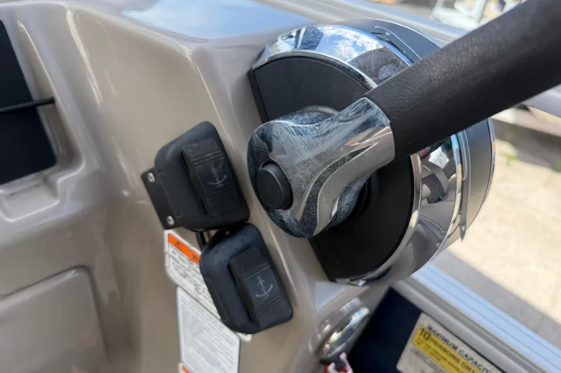 Slide: The Image of Close-up of 2021 Sun Tracker SportFish 22 DLX boat throttle and controls. - 39