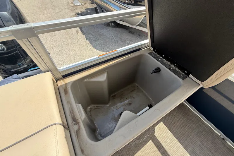 Slide: The Image of Open storage compartment on a 2021 Sun Tracker SportFish 22 DLX pontoon boat. - 46