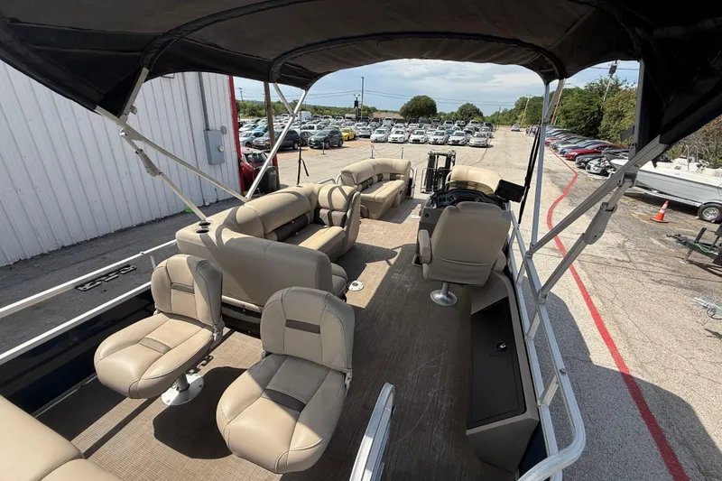 Slide: The Image of 2021 Sun Tracker SportFish 22 DLX pontoon boat with spacious seating and canopy. - 48