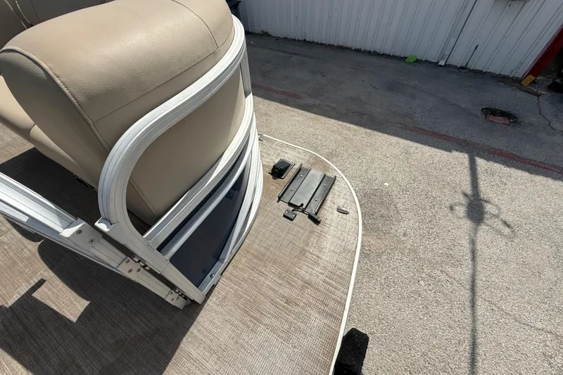 Slide: The Image of 2021 Sun Tracker SportFish 22 DLX boat interior with beige seating and deck details. - 51