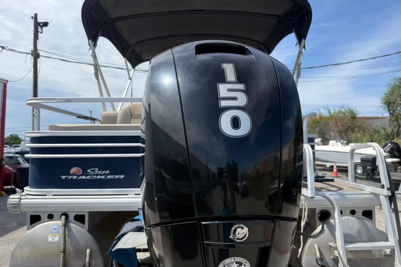 Slide: The Image of Sun Tracker SportFish 22 DLX 2021 with powerful 150 HP outboard motor. - 6