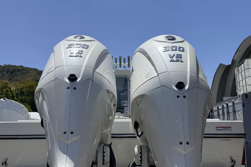 Slide: The Image of Twin 300 V6 outboard engines on a 2026 Defiance Admiral 270 EX boat. - 11