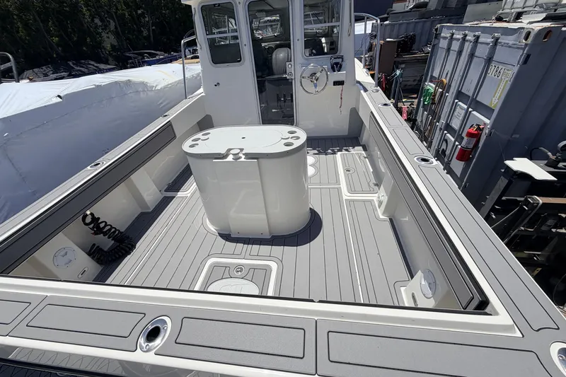Slide: The Image of Spacious deck of 2026 Defiance Admiral 270 EX boat with modern features. - 14
