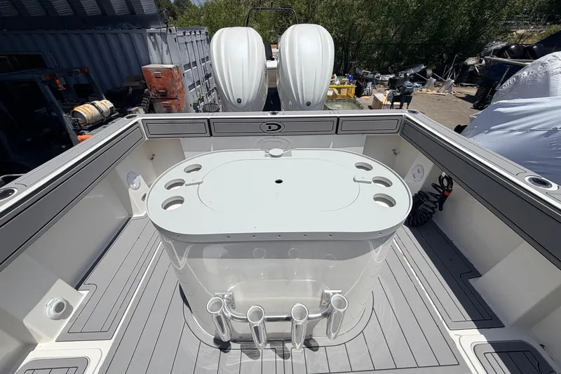Slide: The Image of 2026 Defiance Admiral 270 EX boat deck with fishing station and twin engines. - 18
