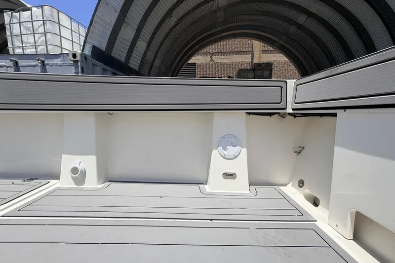 Slide: The Image of Interior view of 2026 Defiance Admiral 270 EX boat, showcasing sleek design and storage compartments. - 22