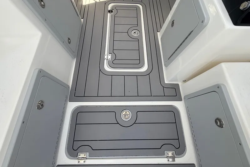 Slide: The Image of Deck of 2026 Defiance Admiral 270 EX boat with storage compartments. - 31