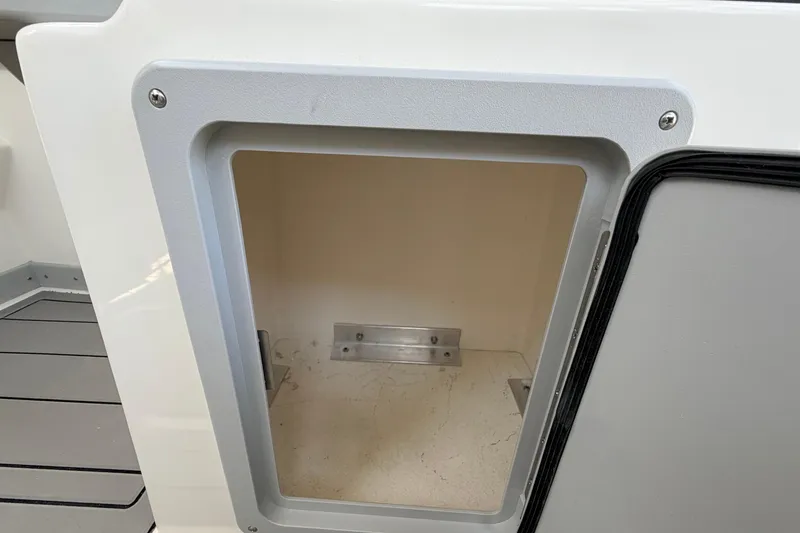 Slide: The Image of Storage compartment on a 2026 Defiance Admiral 270 EX boat. - 37