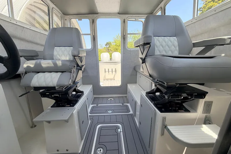 Slide: The Image of Interior of 2026 Defiance Admiral 270 EX boat with modern seating and controls. - 40