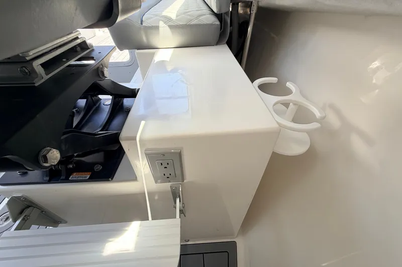 Slide: The Image of Interior of 2026 Defiance Admiral 270 EX boat with seat and cup holder. - 42