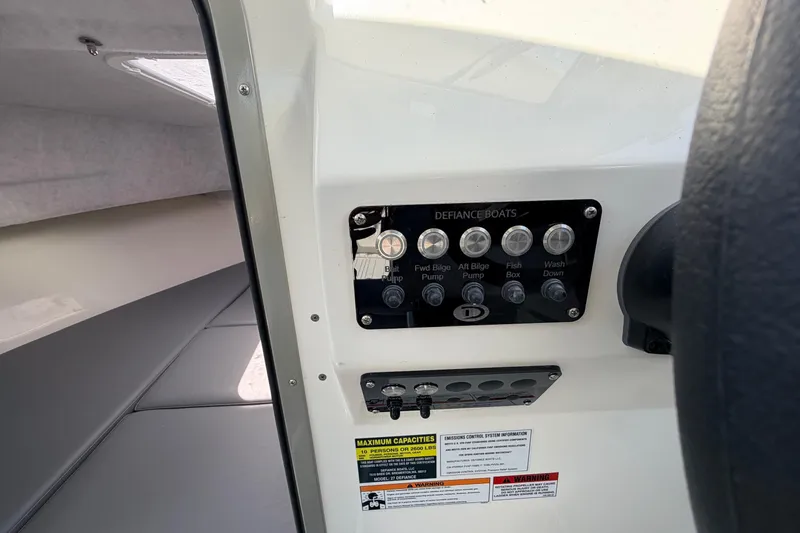 Slide: The Image of Control panel of 2026 Defiance Admiral 270 EX boat, featuring various switches and labels. - 45