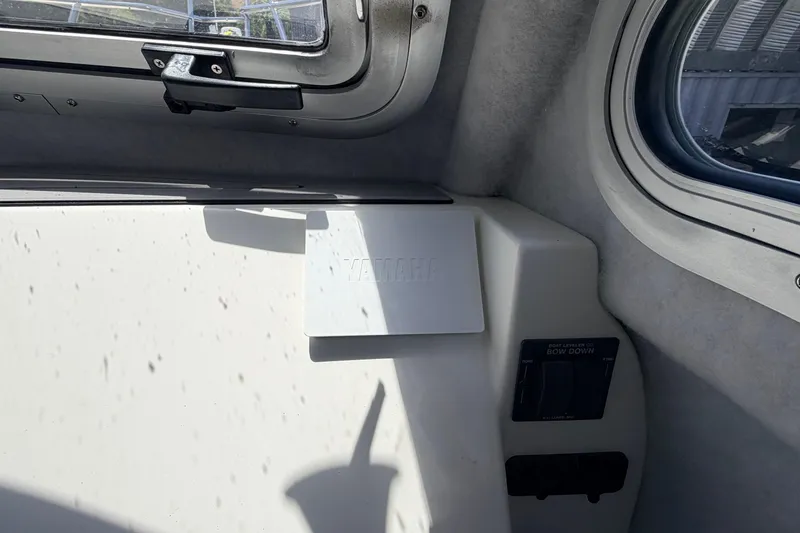Slide: The Image of Interior view of 2026 Defiance Admiral 270 EX boat with window and control panel. - 51