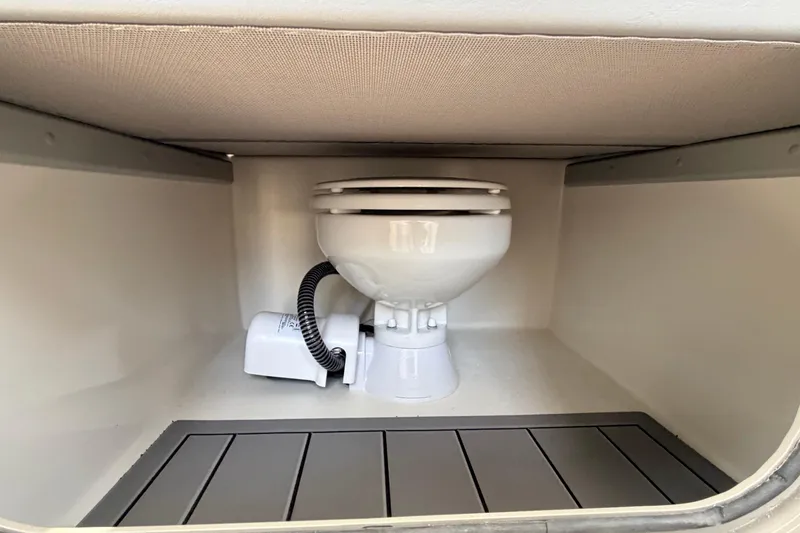 Slide: The Image of Boat toilet in 2026 Defiance Admiral 270 EX cabin, showcasing compact marine design. - 52