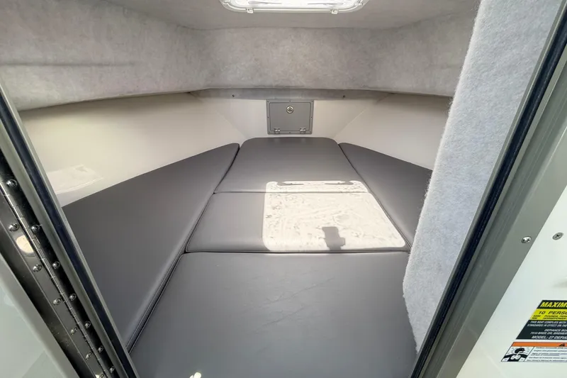 Slide: The Image of 2026 Defiance Admiral 270 EX cabin interior with cushioned sleeping area. - 53